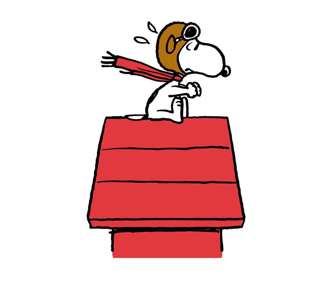 A boy with yellow hair sitting in front of a red piano