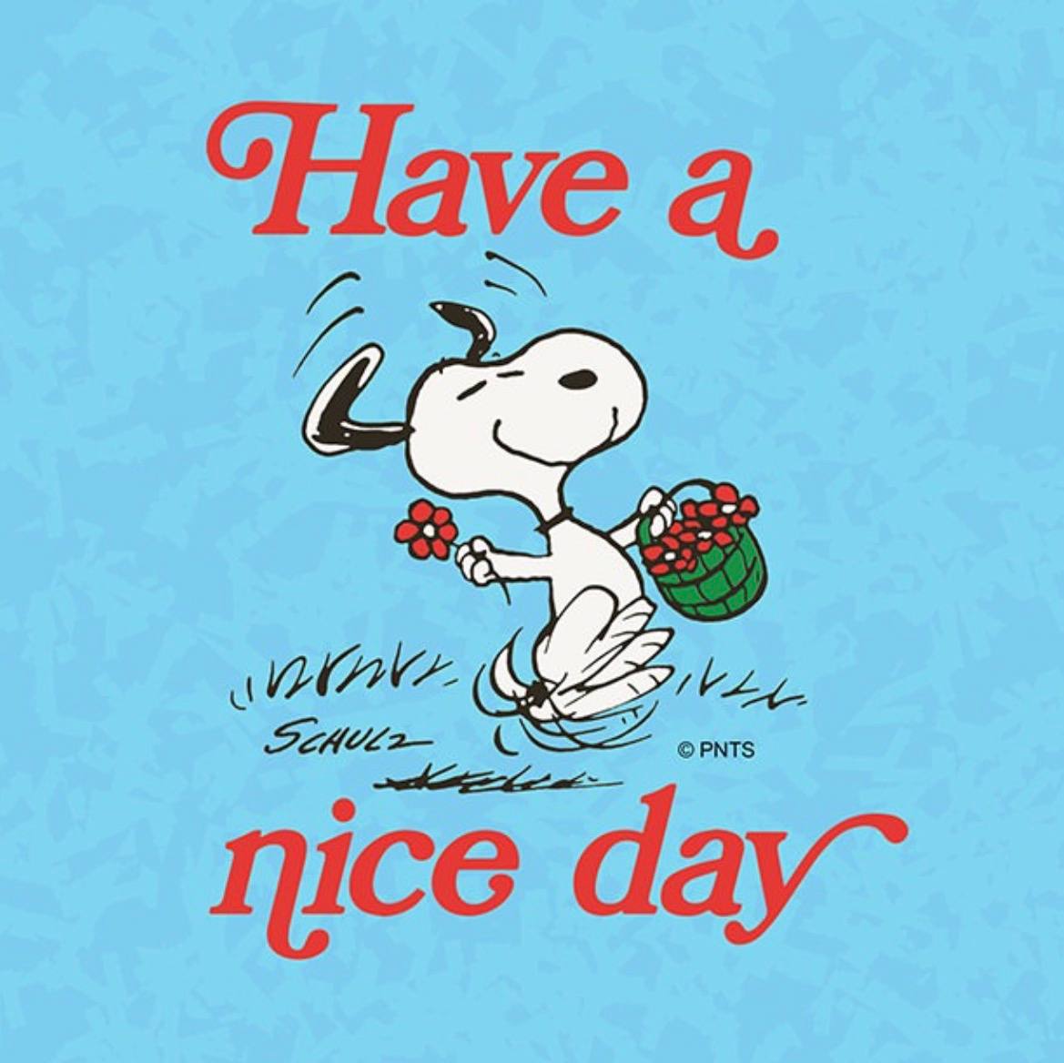 A boy wearing a orange jacket and blue pants